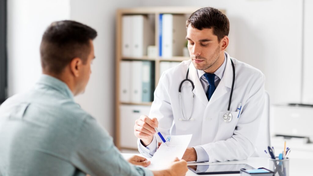 One of the types of doctors that can prescribe Suboxone provides assistance to a male client.