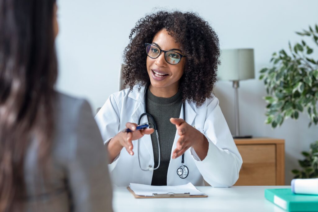 A woman discusses suboxone film vs tablet with her doctor.